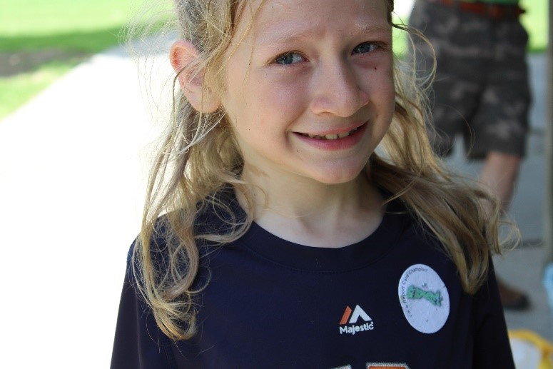          Asher smiles for a picture after the pollution pick-up game!