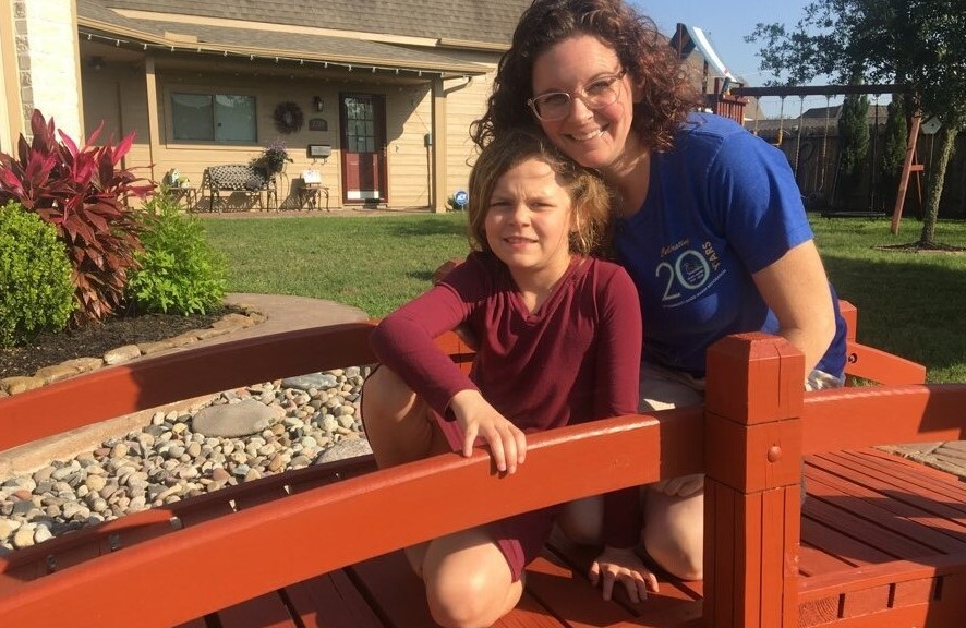 Emily, Community Programs Manager, searching for wildlife with daughter, Taryn, in their backyard.