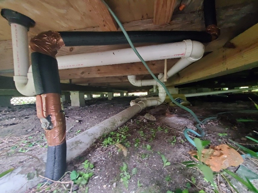 Insulated pipes under a Galveston Island house.