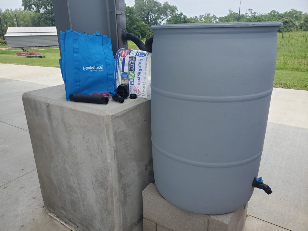 Rain barrel connected to gutter downspout